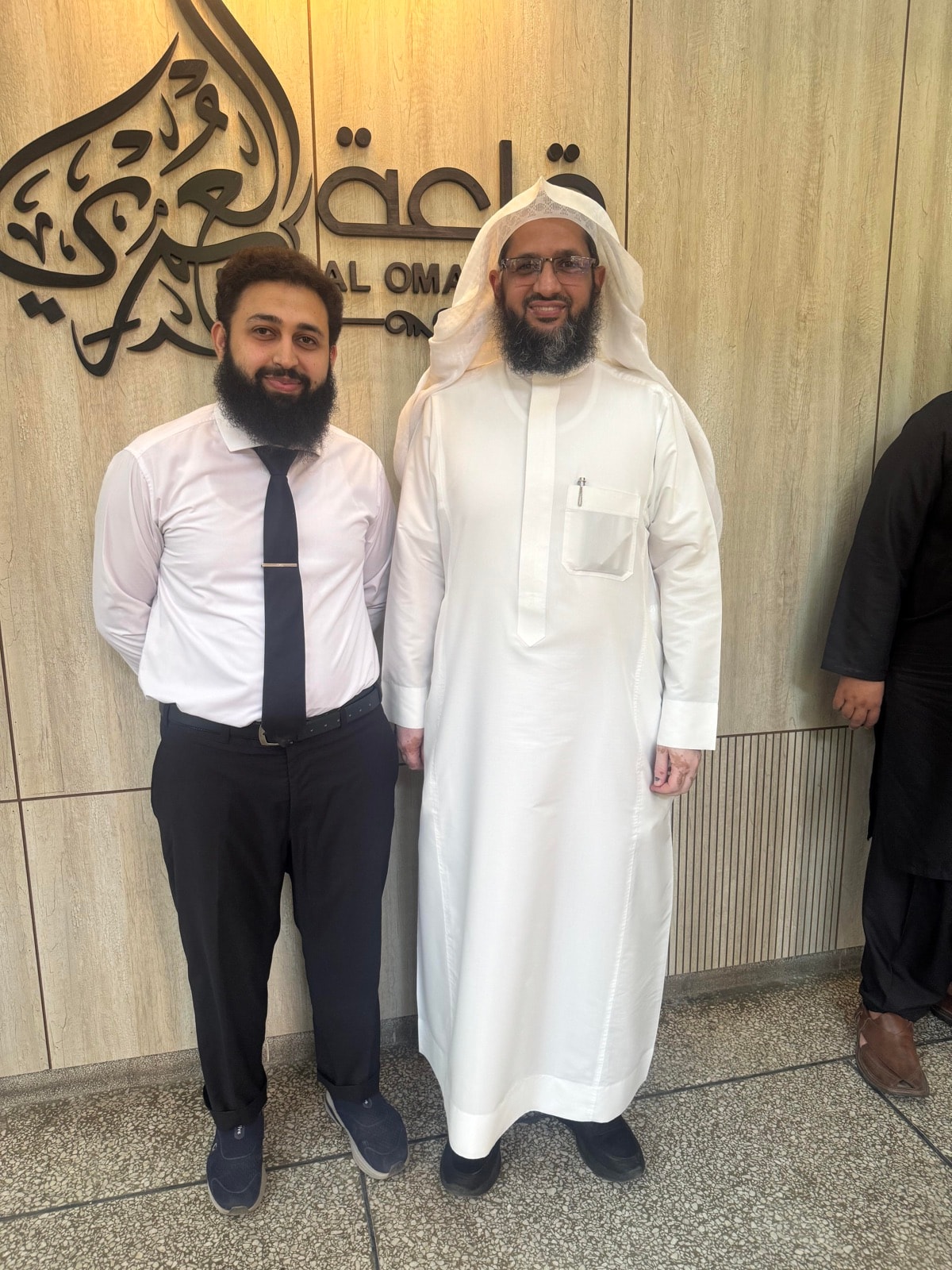 Ahmad Faraz with a Saudi business partner at Al Omar Hall