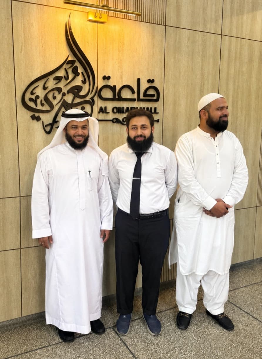 Ahmad Faraz with partners at a formal business gathering